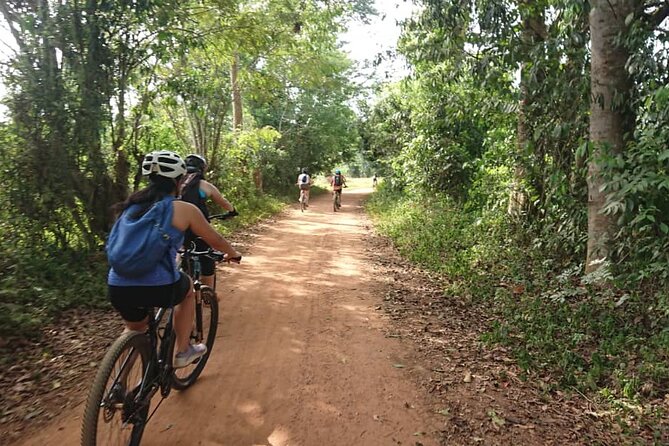 3 Hours Guided Cycling Tour Across Lake Victoria - Safety and comfort: helmets, mountain bikes, and muddy rainy-season trail reality